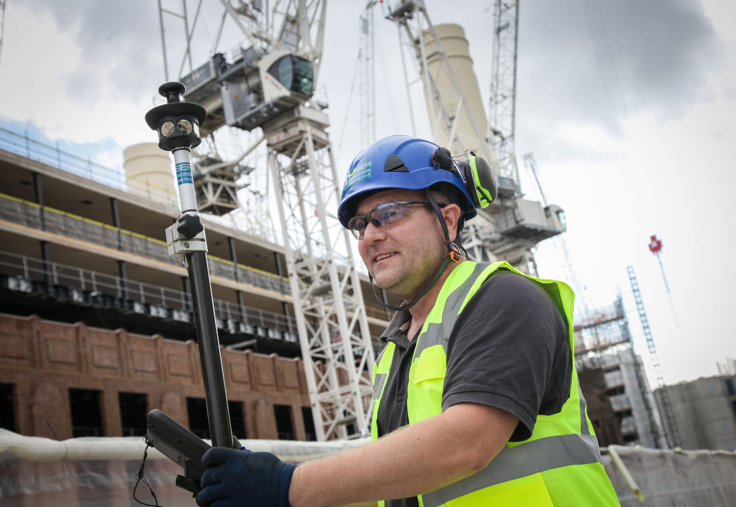 Setting out engineer in Hounslow marking site layout